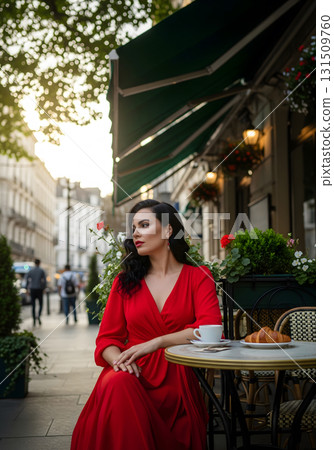 A woman in a red dress at a Parisian cafe 131509760