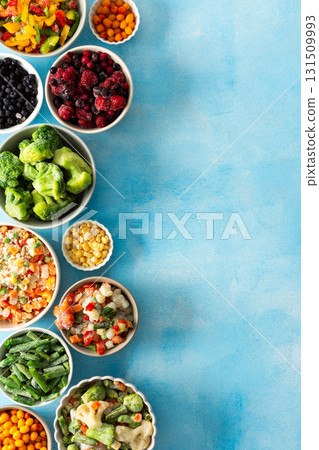 Various frozen veggies such as peas, carrots, and beans preserved in plates, a fresh and practical solution for winter meal preparation and healthy living, vegetables in plates on a blue background Various frozen veggies such as peas, carrots, and beans preserved in plates, a fresh and practical solution for winter meal preparation and healthy living, vegetables in plates on a blue background 131509993