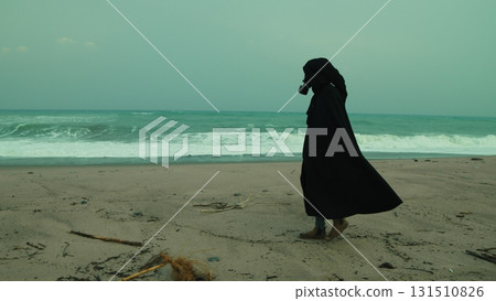 A Man In A Cloak And Gas Mask Walks On A Radiation Poisoned Beach A Man In A Cloak And Gas Mask Walks On A Radiation Poisoned Beach 131510826