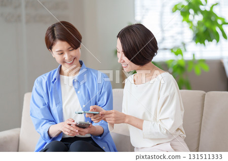 Women using smartphones Women using smartphones 131511333