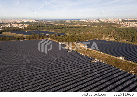 Rows of solar panels in fields near townscape on Rows of solar panels in fields near townscape on 131511660