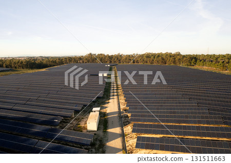 Rows of solar panels arranged in parallel lines 131511663