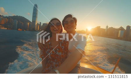 Happy couple sunset boat ride joyful travel lifestyle romance Happy couple sunset boat ride joyful travel lifestyle romance 131511815