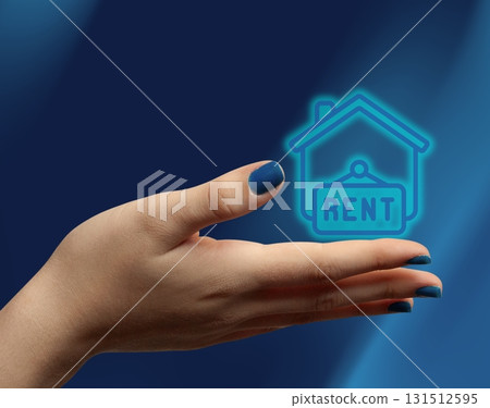 Woman hand holding digitalhouse icon, concept of renting property management 131512595