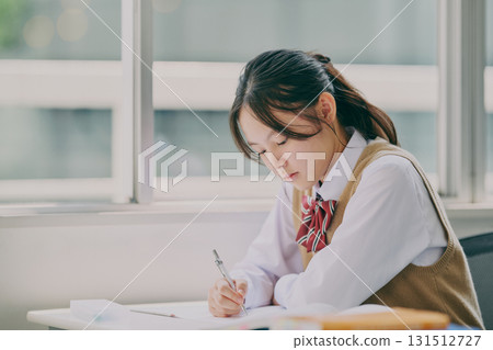 Junior high school students studying in a cram school classroom Junior high school students studying in a cram school classroom 131512727