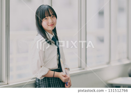 Female junior high school student portrait by the window 131512766