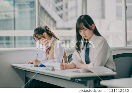 Junior high school students studying in a cram school classroom Junior high school students studying in a cram school classroom 131512980