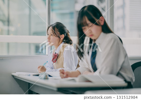 Junior high school students studying in a cram school classroom Junior high school students studying in a cram school classroom 131512984