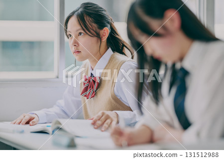 Junior high school students studying in a cram school classroom Junior high school students studying in a cram school classroom 131512988