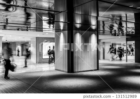 Monochrome blurred shots of people walking through the underground shopping mall in Umeda, Osaka Monochrome blurred shots of people walking through the underground shopping mall in Umeda, Osaka 131512989