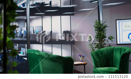 Empty office space showcases a monitor with financial data during meetings, running detailed infographics in a high end decorated workspace. Develop business strategies for success. Empty office space showcases a monitor with financial data during meetings, running detailed infographics in a high end decorated workspace. Develop business strategies for success. 131513120