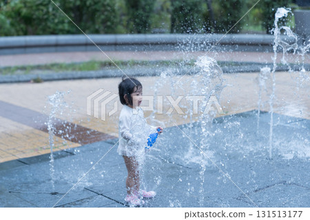 Japanese toddlers playing in the fountain at the apartment complex 131513177