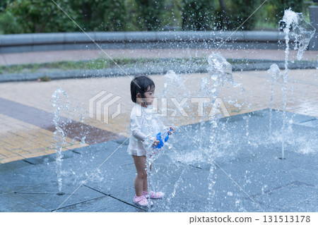 Japanese toddlers playing in the fountain at the apartment complex 131513178