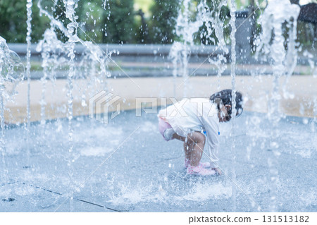 Japanese toddlers playing in the fountain at the apartment complex Japanese toddlers playing in the fountain at the apartment complex 131513182