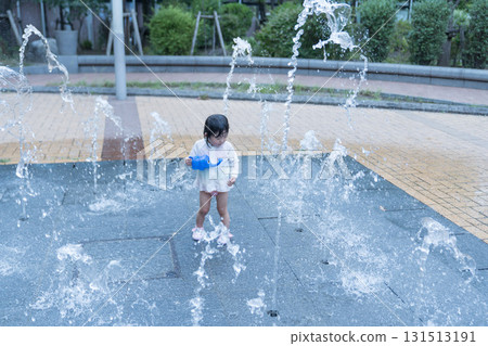 Japanese toddlers playing in the fountain at the apartment complex 131513191