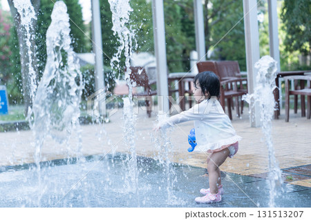 Japanese toddlers playing in the fountain at the apartment complex Japanese toddlers playing in the fountain at the apartment complex 131513207