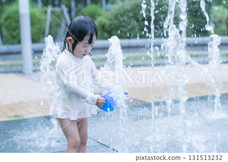 Japanese toddlers playing in the fountain at the apartment complex 131513232