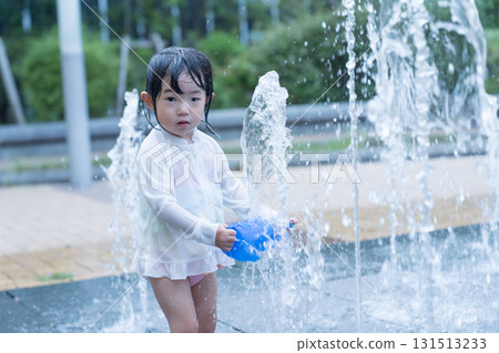 Japanese toddlers playing in the fountain at the apartment complex Japanese toddlers playing in the fountain at the apartment complex 131513233