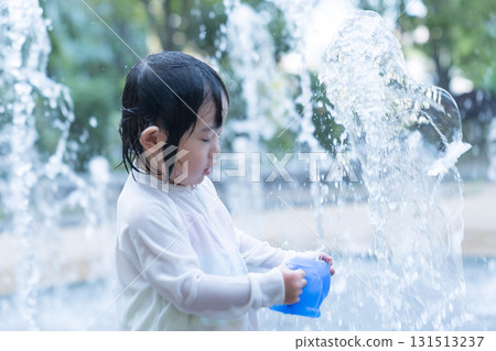 Japanese toddlers playing in the fountain at the apartment complex Japanese toddlers playing in the fountain at the apartment complex 131513237