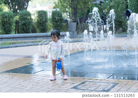 Japanese toddlers playing in the fountain at the apartment complex Japanese toddlers playing in the fountain at the apartment complex 131513263