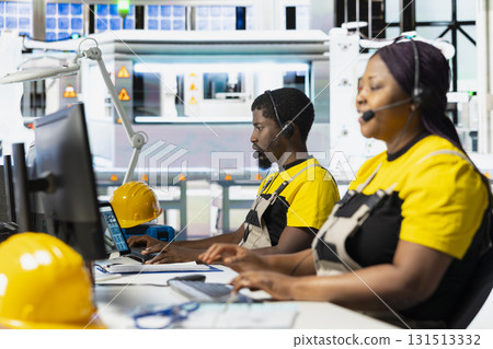 Black female plant worker offering guidance in troubleshooting errors at solar facility call center, managing help line requests for support and maintenance. Customer service operator. 131513332