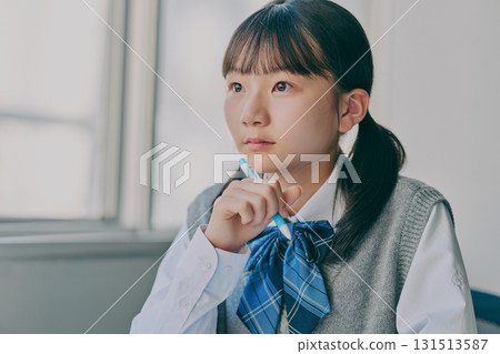Female junior high school student studying in a cram school classroom 131513587