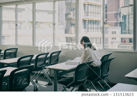 Female junior high school student studying in a cram school classroom Female junior high school student studying in a cram school classroom 131513623