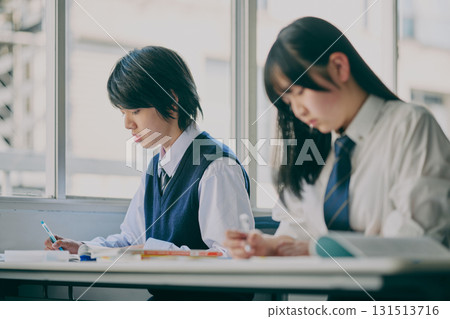 Junior high school students studying in a cram school classroom Junior high school students studying in a cram school classroom 131513716
