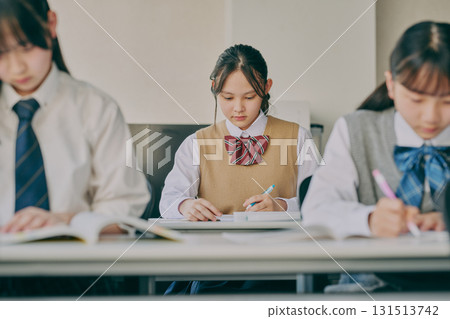 Junior high school students studying in a cram school classroom Junior high school students studying in a cram school classroom 131513742