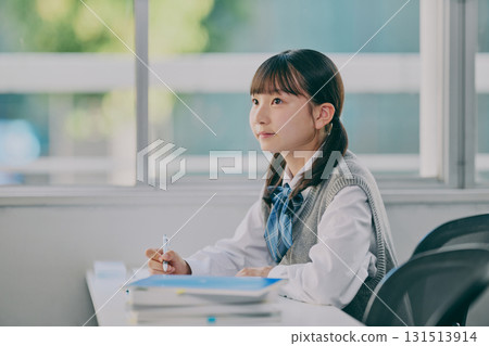 Female junior high school student studying in a cram school classroom Female junior high school student studying in a cram school classroom 131513914