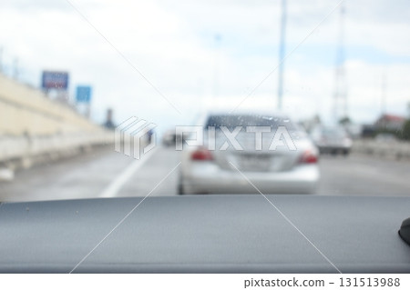 highway traffic with safety barrier on road asphalt, blurred image 131513988