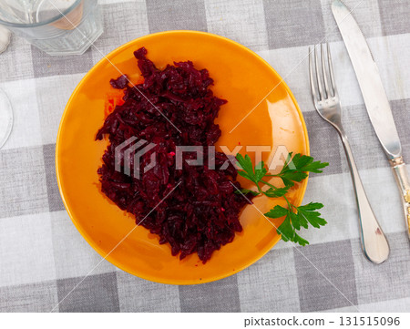 Popular russian salad, made from boiled grated beetroot, decorated with herbs Popular russian salad, made from boiled grated beetroot, decorated with herbs 131515096