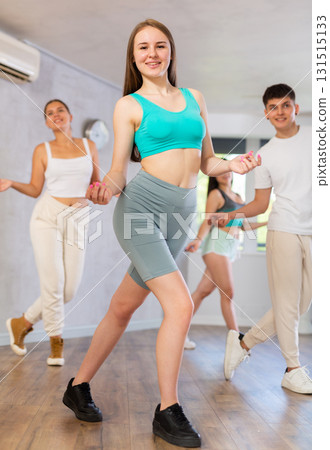 Group of young women and young guy dancing jazz funk 131515133