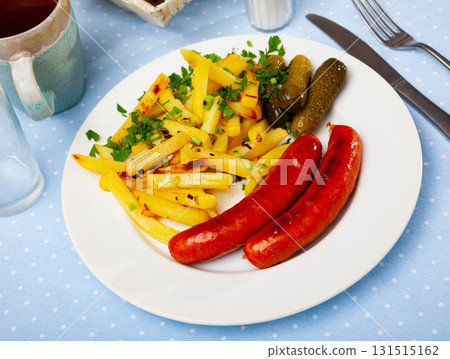 Baked frankfurters with fried potatoes and marinated gherkins Baked frankfurters with fried potatoes and marinated gherkins 131515162