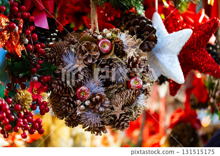Traditional colorful handmade Christmas decorations on festive street fair Traditional colorful handmade Christmas decorations on festive street fair 131515175