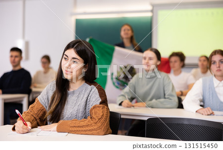 Young girl student diligently studies at school 131515450