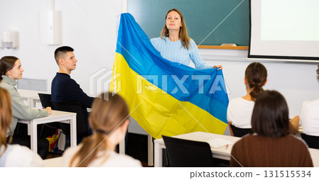 Teacher with the flag of Ukraine tells the history of the emergence of state 131515534
