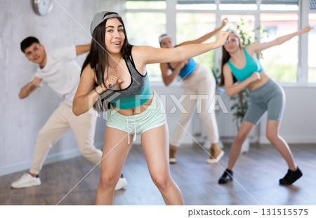 Dance class for teenages, positive girl and boy training in studio 131515575