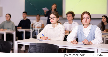 Young girls students study diligently at school 131515628