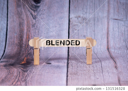 Blended symbol. Single Wooden stick supported by Clothespins, beautiful Light Orange tone highlight Wooden Texture Background. Business and Blended concept with copy space Blended symbol. Single Wooden stick supported by Clothespins, beautiful Light Orange tone highlight Wooden Texture Background. Business and Blended concept with copy space 131516328
