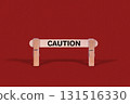 Caution symbol. Wooden stick braced by Clothespins, beautiful Red Background. Business and Caution concept with copy space 131516330