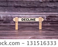 Decline symbol. Wooden stick held by Clothespins, beautiful Realistic Grunge Wooden Background. Business and Decline concept with copy space 131516333