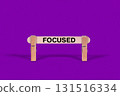 Focused symbol. Wooden stick suspended by Clothespins, Purple hues Backdrop. Business and Focused concept with copy space 131516334