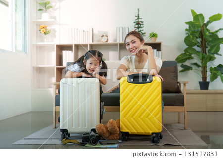 Family Travel. Smiling mother and daughter with luggage ready for adventure. Family Travel. Smiling mother and daughter with luggage ready for adventure. 131517831