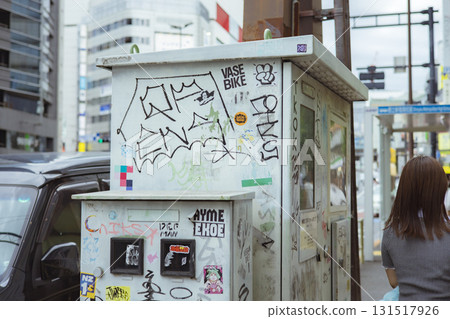 Electrical equipment covered in stickers and graffiti 131517926