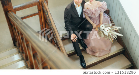 Couple taking wedding photos in a retro building Couple taking wedding photos in a retro building 131518290