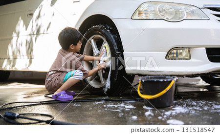 5-year-old boy helping with car wash 5-year-old boy helping with car wash 131518547