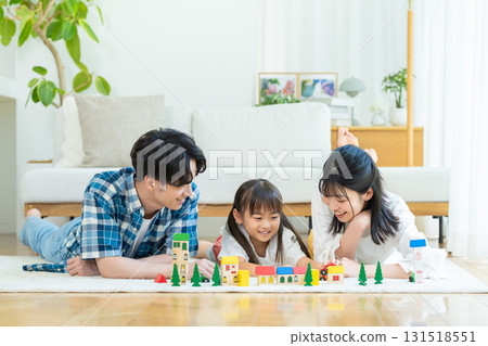 Families playing in the living room Families playing in the living room 131518551