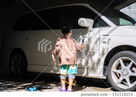 5-year-old boy helping with car wash 5-year-old boy helping with car wash 131518553