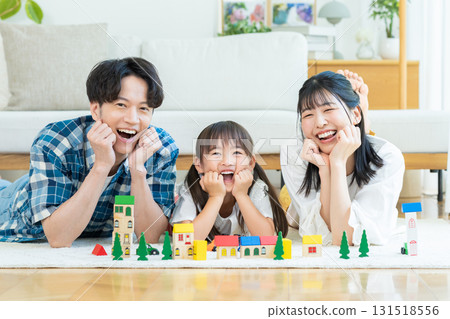 Families playing in the living room Families playing in the living room 131518556